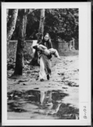 Woman Carrying a Wounded Child to a U.S. First-Aid Station, Tet Offensive