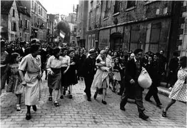 A Young Woman Who Had a Baby by a German Soldier is Marched Home, Chartres, France