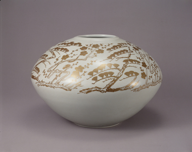 White jar with design of pine and plum branches, overglaze gold